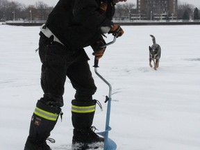 Jesse VanRooyen drills a hole in the ice in Sarnia Bay for a recent afternoon of fishing. The Bluewater Anglers will hold its annual ice fishing derby Feb. 16, beginning at 6 a.m. It's being held on a Family Fishing Weekend when a fishing licence isn't required in Ontario. The derby's weigh-in station will be located in the boat ramp parking lot in Centennial Park. PAUL MORDEN/THE OBSERVER/QMI AGENCY