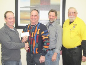 Pork Producers’ representative Andrew Black (left) presents cheques to Wayne Bryce of the Paisley United Church; Steven Lembke of the Desboro Lions’ Club and Ken Polfuss of the Neustadt Lions’ Club.