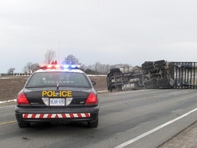 No injuries were reported after a transport truck flipped on its side on Highway 40, late Monday morning, Feb. 11, 2013, just north of Countryview Line, near Oungah, Ont. The road was reopened a few hours later.
BOB BOUGHNER/ THE CHATHAM DAILY NEWS/ QMI AGENCY