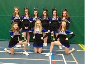 Cheer leading troup comprised of students from Cold Lake High School and Assumption Jr./Sr. High School students pose for a photo after their successful competition in Athabasca.