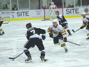 The Vermilion Tigers’ Edward Haarsma swoops in on the Cold Lake Ice’s Reece Fenrich as Fenrich prepares to shoot the puck during Feb. 9 action at Cold Lake arena. The Ice were victorious in that game, 12-2.