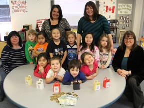 Students in the Junior Kindergarten class at Chippewa Day Nursery presented $500 to the Autism Ontario, Sarnia-Lambton chapter, Monday. Pictured are: (back) Leanne Williams and Janey Brown; (middle) Kim Henry (teacher), Cole Oliver, Julius Sinipole, Darius Sinipole, Santana Plain, Cianna Mitchell, Sophie Williams, Kathleen Foubsiter (Austism Ontario); (front) Kiona Plain, Landyn WIlliams, James Bird, Miley Thompson. TARA JEFFREY/THE OBSERVER/QMI AGENCY
