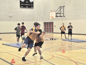 Travis King, of Mayerthorpe Junior Senior High School, powers past a defender during a drill at the U18 Elite Albertaa Handball Team tryouts on Friday,  Feb. 8 in Whitecourt.