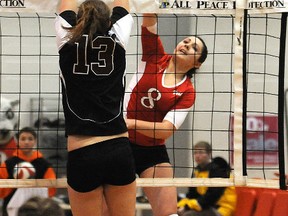 Wolves outside hitter Tonya Dueck smashes past  Griffin Corrina Caouettein ACAC women’s volleyball at GPRC gym Friday. (Terry Farrell/Daily Herald-Tribune)