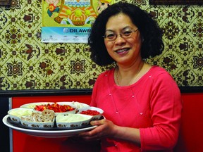 Meda Pao was pleased to share treats to ring in the Chinese New Year Sunday with customers at Dick's Cafe. (Kevin Hirschfield/Portage Daily Graphic/QMI Agency)