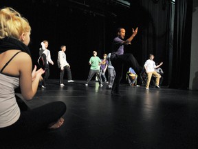 Patrick Parson, artistic director for Ballet Creole, leads students through an Afro-Caribbean dance during the Dance! Dance! Dance! workshop at the St. Clair College Capitol Theatre Monday. (DIANA MARTIN, The Chatham Daily News)