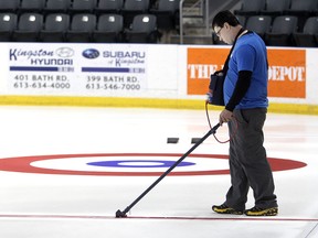 Mark Shurek paints the lines at the K-Rock Centre for the upcoming Scotties Tournament of Hearts.
Michael Lea The Whig-Standard