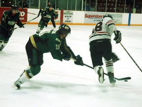 St. Thomas forward Mike Iacocca picks the puck away from Sarnia Legionnaire Derek D'Andrea during the Stars' 5-3 win Sunday at the Timken Centre. (Nick Lypaczewski, Times-Journal)
