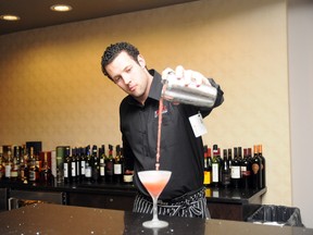Bartender Luke Ryder pours a traditional cosmopolitan cocktail into a frosted martini glass at The Office. The new restaurant is located on the main floor the Pomeroy Hotel & Conference Centre (formerly Grande Prairie Inn) at 11633 100 Street. (Patrick Callan/Daily Herald-Tribune)