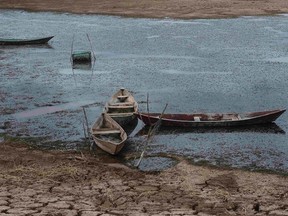 Boats lie on the dry lakebed of the Cocorobo Dam in Brazil, which is suffering its worst drought in decades. As the Responsibility to Protect doctrine evolves, its early proponents are looking at ways to apply it to non-military problems, such as food-security issues.