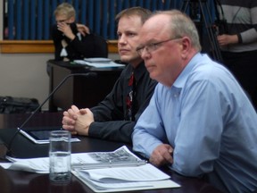 Dan Drouin and Morris McCormick present a report from the energy efficiency working group to councillors on Monday.