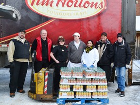 Pictured (left to right) TDL driver, Keith Ruffer, Ed Giles of the Salvation Army, Spencer MacLeod, Steve MacDonald, April Gantalao, owner Louise Harshman and Grant Magill.