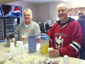 Good TImer hockey players Lee Fuller and Steve McPherson serve up some fresh coffee and orange juice at their fundraiser breakfast.