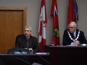 Chief administrative officer Norm Levac speaks to councillors on Monday, while Mayor Bob Kilger looks on.