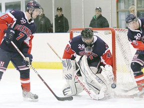 Icemen goaltender Jeremy Balyk makes a save during a game against the Beaumont Chiefs, while d-men Steven Walker (left) and Kevin Liner try to clear the crease at the Civic Centre Jan. 13. Balyk was in net for both of the Icemen’s last games of the regular season.