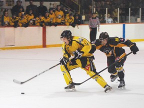 Elliot Lake Bobcats forward Henry Berger break away from an Abitibi Eskimos defender during action from their game on Friday, Feb. 9 at the Centennial Arena. 
Photo by STEVE ANTUNES/FOR THE STANDARD