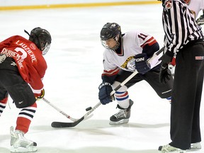 Schumacher Sharks’ forward Noah Lauziere takes the draw against Chase Kasner of the Kirkland Lake Kohut Blue Devil in a bantam tilt on Saturday at the Whitney Arena during the Porcupine Classic Hockey Tournament held this past weekend.