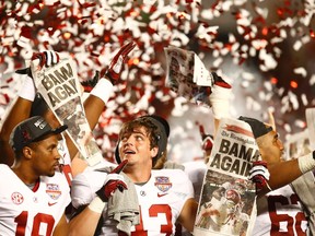 Four members of the national-champion Alabama Crimson Tide have been suspended after being charged with robbery or fraud. (REUTERS file photo)
