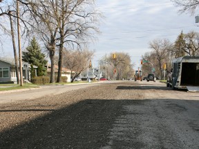 A portion of 5th St. SE between Dufferin Ave. and Queen Ave. pictured after utility work was completed last summer. The City said it hopes to pave the rough section of road in May or June of 2013. (FILE PHOTO)