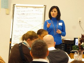 Jillian Tanner, of 211 Southwestern Ontario, addresses St. Thomas and Elgin community social service providers discussing youth homelessness Tuesday in St. Thomas. The social services resource hotline is to begin serving the community. (Eric Bunnell, Times-Journal)