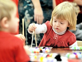 Brielle Malone attempts to capture a pom-pom with chopsticks during a Chinese New Year celebration for the Junior and Senior Kindergarten classes at Our Lady of Fatima Catholic School in Chatham, On., Tuesday February 12, 2013. (DIANA MARTIN, The Chatham Daily News)