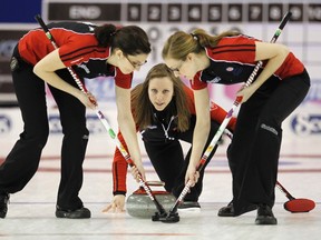 Ontario skip Rachel Homan, centre, delivers a shot behind lead Lisa Weagle, left, and second Alison Kreviazuk in a playoff game against Nova Scotia at the Scotties Tournament of Hearts curling championship in Charlottetown in 2011. Homan’s rink, which includes third Emma Miskew, will represent Ontario again at the championship in Kingston next week. (Reuters file photo)