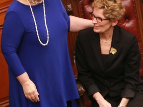Ontario Premier Kathleen Wynne recently sworn into office, with Deputy Premier Deb Matthews. (DAVE THOMAS/Toronto Sun)
