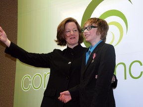 Premier Alison Redford presented 11-year-old Nathaniel Crossley with a diamond jubilee medal at Tuesday’s Convergence YMM summit, held at the Quality Inn. AMANDA RICHARDSON/TODAY STAFF