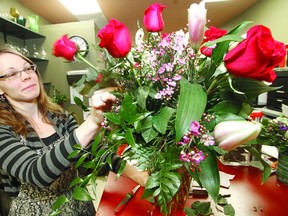 Who says Stratford residents aren't romantic? Here, floral designer Amanda Speelman of Catherine Wright Designs by Laura Barker arranges a beautiful bouquet for Valentine's Day Tuesday. (MIKE BEITZ, The Beacon Herald)