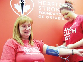 Cindy Rowe, area manager for the Heart and Stroke Foundation, has her blood pressure checked by nursing student Michelle Seguin. High blood pressure is a leading risk factor for stroke. The Heart and Stroke Foundation is hoping the community will make even a small change in their lives now to improve their lives later and become educated on the risks during Heart Month in February.
Staff photo/ERIKA GLASBERG