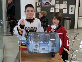 Paris Minor Hockey Association novice players Dante Colaiacovo, left, and Owen Miller select the winners of the PMHA annual fundraising draw on Monday, Jan. 28, 2013. SUBMITTED PHOTO