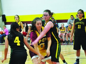 Katie Hannah of the Saints is defended by two Tec Voc players during Tuesday's game. (Kevin Hirschfield/PORTAGE DAILY GRAPHIC/QMI AGENCY)