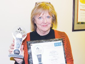 Susan Ellis, economic development manager for Pembroke, is retiring after 17 years of service to the city. Here in this file photo, she shows the two awards the city received from the Economic Development Council of Ontario, recognizing their work promoting the community online.