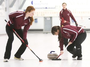 The Scollard Hall Bears boys and Algonquin Barons girls won NDA curling championships at the Granite Club, Tuesday. Above, Algonquin Barons alternate Lexi O'Connor-Bergeron, left, and Renee Claude-Grenier, right, sweep for a rock thrown by skip Marielle Rochefort during an NDA girls curling final against Franco Cite at the Granite Club, Tuesday. The Barons won 9-4.