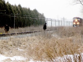 An unidentified Chatham woman died when her vehicle struck a moving freight train, crossing Prince Albert Road, east of Chatham Tuesday night.
