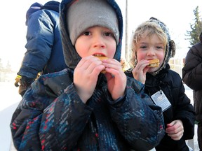 Jasper Jenkins, 6, and Ella Rockwell,6, chow down on some gooey s'mores at the McKernan Winterfest 2013 at the McKernan Community League Hall on Sunday, Feb. 10, 2013. McKernan residents were joined by local politicians for a cheque presentation and ground breaking ceremony as the community league received $600,000 in matching provincial and municipal grants to renovate the aging building.