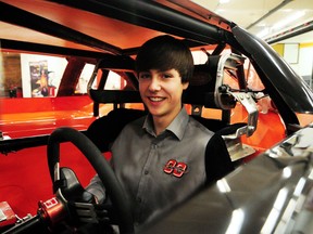 Canada’s youngest stock car driver, Denver Foran, 15, shows off his new stock car to students at Jasper Place high school last week. Foran, and the sport of stock car racing, were officially added to the school’s Elite Athlete program. TREVOR ROBB Edmonton Examiner
