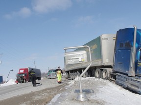 Charges are pending in a collision between two tractor-trailers on Highway 59 south on Wednesday, Feb. 13. (HEATHER RIVERS/WOODSTOCK SENTINEL-REVIEW)
