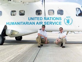 Devin Mahoney, right, with Captain Tommy Riopel in front of a Dornier 228, during a stop in the Canary Islands en route to Côte d’Ivoire, West Africa.