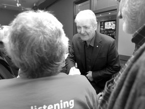 Marc Garneau shakes hands with supporters at the Loaf and Ale on Monday morning.