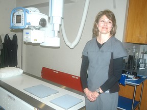 Colleen Gleeson, an X-ray technologist with the Chatham-Kent Health Alliance, shows off the new X-ray machine at the CKHA's Sydenham campus in Wallaceburg. CKHA held the grand opening of the new equipment on Wednesday and hosted tours of the new X-ray unit. David Gough/ QMI Agency