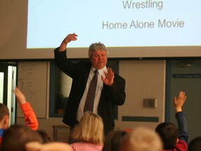 Mike Neuts speaks to elementary students at Hines Creek Composite School