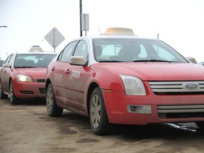 A fleet of Canadian Cabs await the arrival of an afternoon flight at the Grande Prairie Airport as part of their two-year contract with the airport for exclusive cab service. The airport is now accepting bids from all cab companies for the next two-year contract scheduled to begin on May 1. (Patrick Callan/Daily Herald-Tribune)