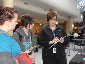 Northern Health recruiter Susan Kelly-Easton talks to third-year nursing students Jaclyn Lucas (left) and Trisha Sydoruk at the Grande Prairie Regional College Career and Recruitment Fair on Wednesday. The event lasted from 10 a.m. to 6 p.m. and targeted students looking for summer positions and post-graduate work. (Elizabeth McSheffrey/Daily Herald-Tribune)