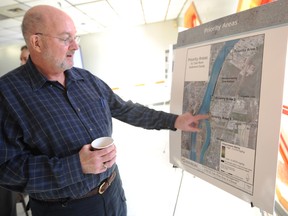 Wayne Wager, 63, checks out a poster showing mercury contamination levels in the St. Clair River at a St. Clair River Conservation Authority-hosted open house in Sarnia Wednesday. The Authority is considering a number of options to manage remaining mercury-contaminated sediments on the Canadian side of the river. TYLER KULA/ THE OBSERVER/ QMI AGENCY
