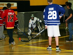Students scrimmage at Composite High School Wednesday during Respect Day before gearing up for the big staff vs. students floor hockey game. AMANDA RICHARDSON/TODAY STAFF