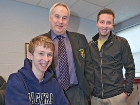 BRIAN THOMPSON, The Expositor

Tyler Van Leeuwen signs a letter of intent to attend Niagara University for cross-country running. Looking on  are St. John's College principal Rob Campbell (centre) and Tyler's coach, Cory Currie, of the Brantford Track and Field Club.