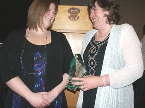 Erica Farrell (right) accepts her University of Alberta 2012 Clinical Educator of the Year: Physiotherapy award from Crystal MacLellan, at Lister Centre on the U of A campus in Edmonton. MacLellan nominated Farrell for the student-driven award. (Terry Farrell/Daily Herald-Tribune)