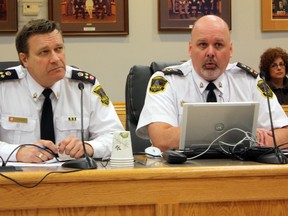 Timmins Police Service (TPS) Deputy Chief Des Walsh, left, and Chief John Gauthier presented the 2013 police service budget to city council on Tuesday. The TPS board, which includes Mayor Tom Laughren and Coun. Michael Doody, will go back to the table to take another look at the budget after city council suggested a review.