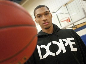 The newest addition to the London Lightning, Dominique Ferguson, holds a basketball in the gym at the YMCA Central Branch in London on Wednesday February 13, 2013.
CRAIG GLOVER The London Free Press / QMI AGENCY